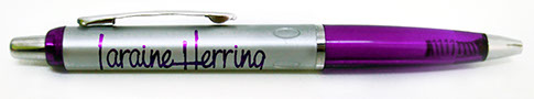 Ball point pen with Laraine Herring logo.